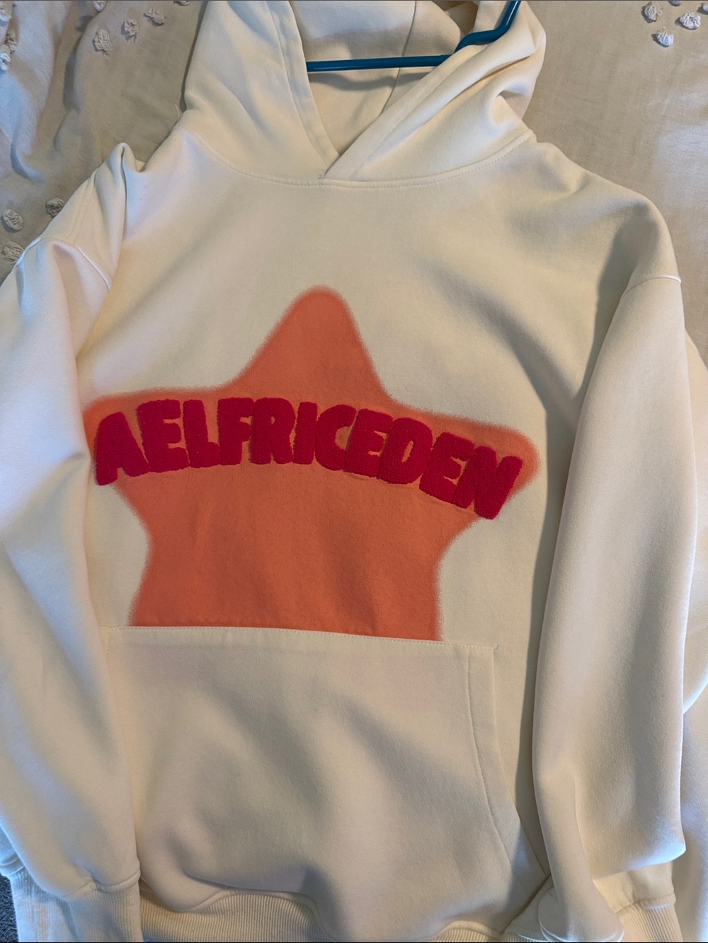 Aelfric Eden White Pullover Hoodie with Orange Star and Pink Logo